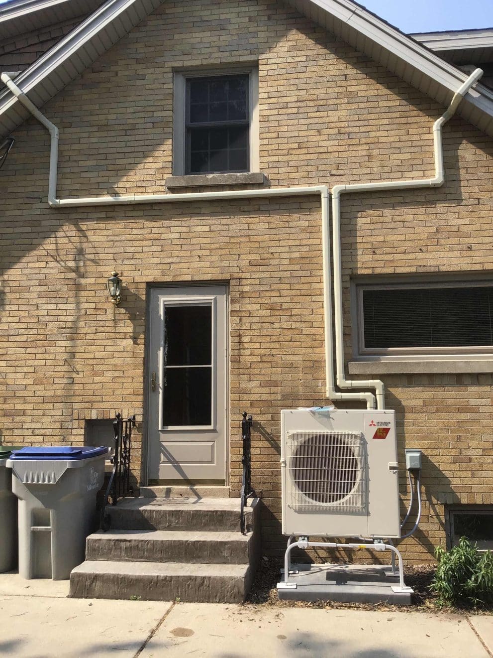 HVAC company in kenosha, air conditioning in kenosha, furnace repair in waukesha. Installation of Mitsubishi Ductless Mini-Split dual head heat pump system in Waukesha, Wisconsin