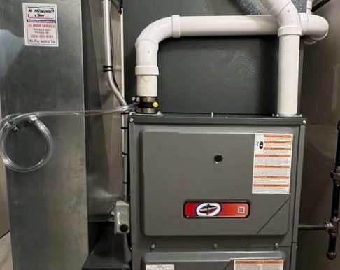 furnace repair company in Kenosha HVAC technician inspecting a furnace, furnace repair company in Kenosha, Misurelli Sorensen Heating & Air Conditioning